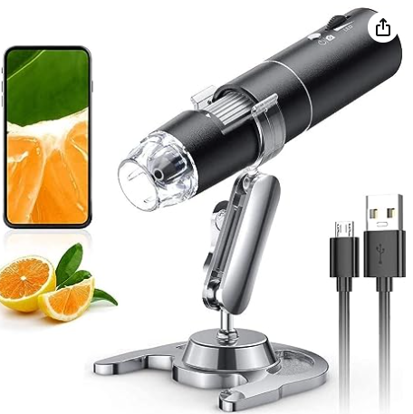 A microscope with a phone and oranges

Description automatically generated