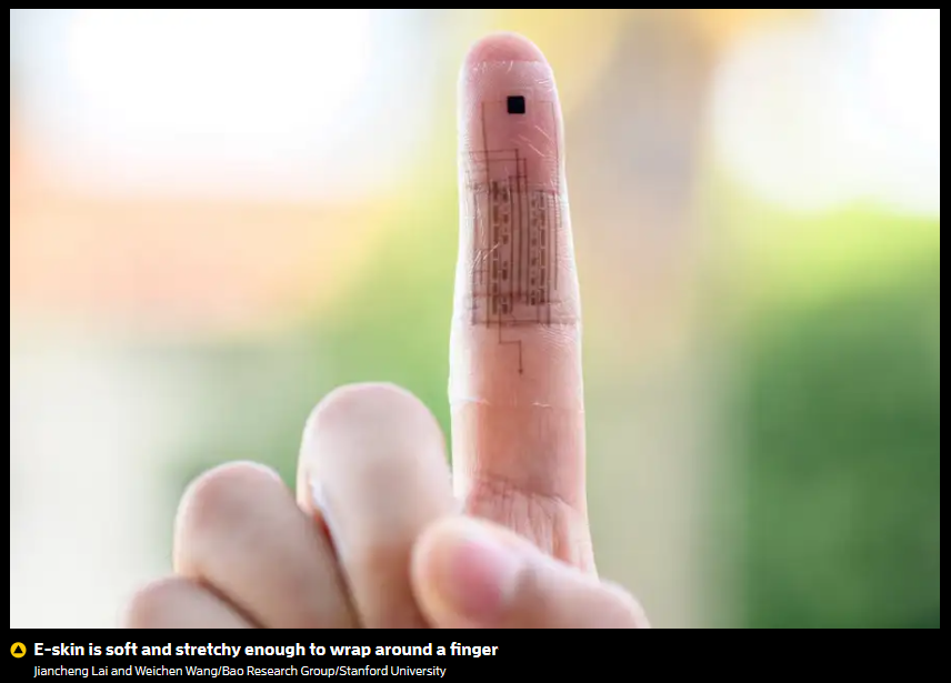 A person's finger with a printed circuit on it

Description automatically generated
